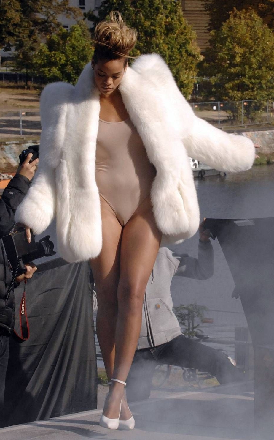 Blonde Ebony Girl with Bare Legs wearing White Fur Coat